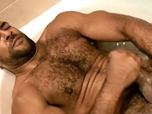 Muscle hairy stud Roman Wright takes a shower and masturbates