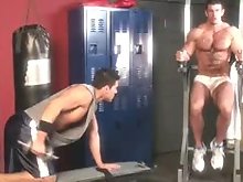 Two muscle dudes in the gym